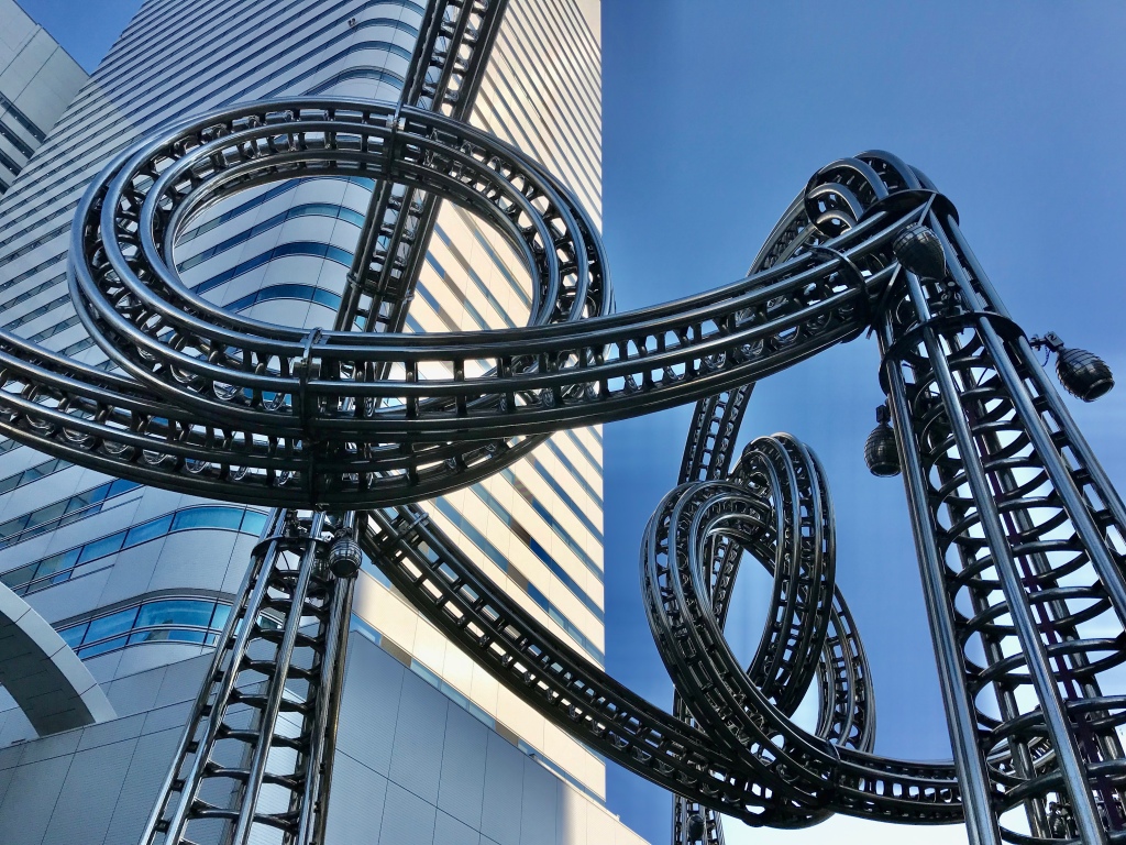 Photograph of a rollercoaster-like structure with many loop-the-loops.